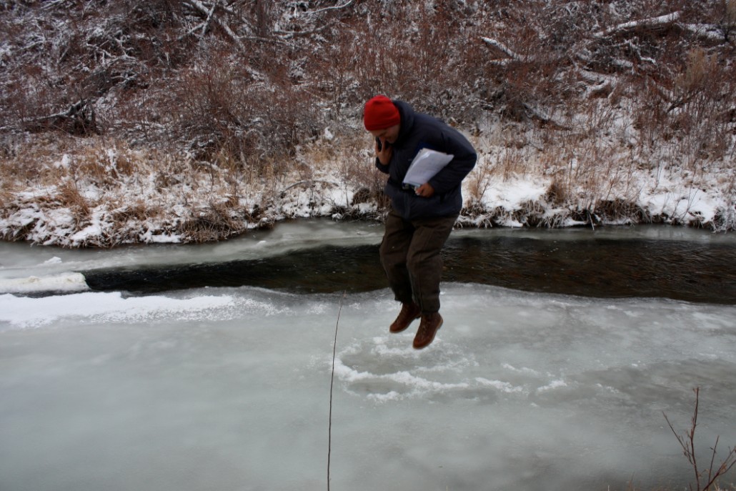 2008-12-18-img_0826-se-small Information Specialist Greg Reis tests the strength of the ice in Rush Creek's Channel 10. Photo by Santiago Escruceria.
