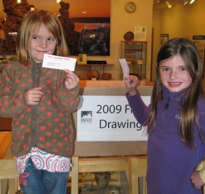 Ellery and Caelen McQuilkin pull two lucky winners in the 2009 Free Drawing. Photo by Elin Ljung.