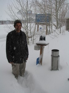 Greg Reis stands knee-deep in fresh snow near the Mono Lake Committee's weather station. Photo by Elin Ljung.