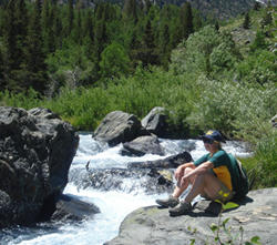 Natalie Holt enjoying a Sierra stream. Photo courtesy of Natalie Holt.