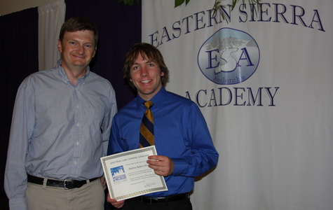 Geoff McQuilkin presented Andrew Oliveira a Mono Lake Committee Scholarship at the Eastern Sierra Academy graduation. Photo by Arya Degenhardt.