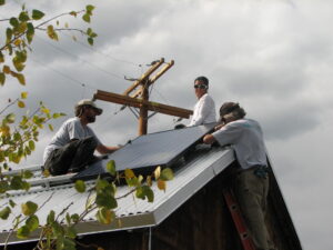 Our first solar panel is secured on the Mono Lake Committee office roof