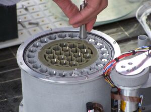 Samples are placed in this container, which would be picked up by a second rover that would be capable of blasting off the surface and bringing them back to Earth. Scientists are still developing a way to seal the samples for the trip back. Photo by Greg Reis.