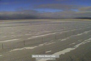 Great Basin Unified Air Pollution Control District "dustcam" looking west at 8:48 am on 12/5/2013. The snow from the previous day is visible in the foreground. The east half of Mono Lake is visible, as well as the islands and Black Point, but the west half and the Sierra are shrouded in clouds and fog.