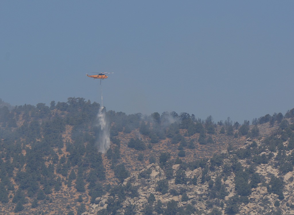 Helicopter drops water from Walker Lake on spotfires near Williams Butte on August 17.