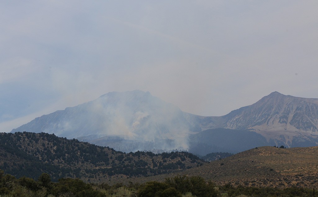 The Walker Fire on August 16 at 1:00pm, looking more subdued compared to the smoke and flames the day before.