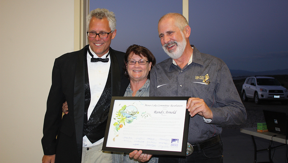 This past summer, Randy (right) was presented with a Mono Lake Committee Board of Directors Resolution in recognition of his steadfast, fun, and creative dedication to Mono Lake. Education Director Bartshe Miller and Board member Martha Davis presented Randy with the resolution. Photo by Erv Nichols.