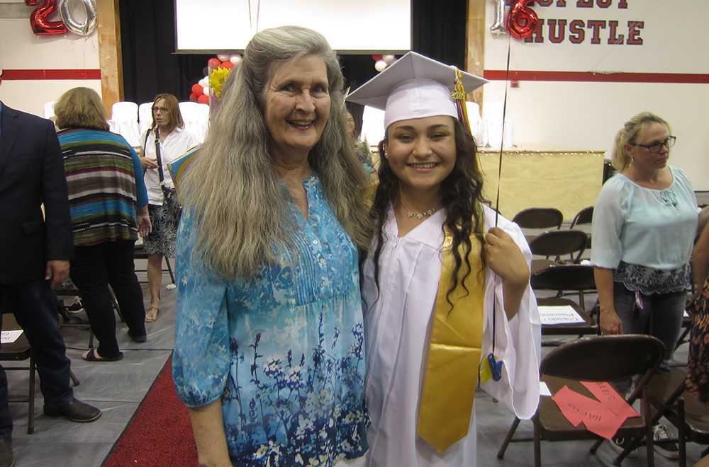 Membership Coordinator Ellen King with scholarship recipient Berlin Del Aguila. Photo by Geoff McQuilkin.