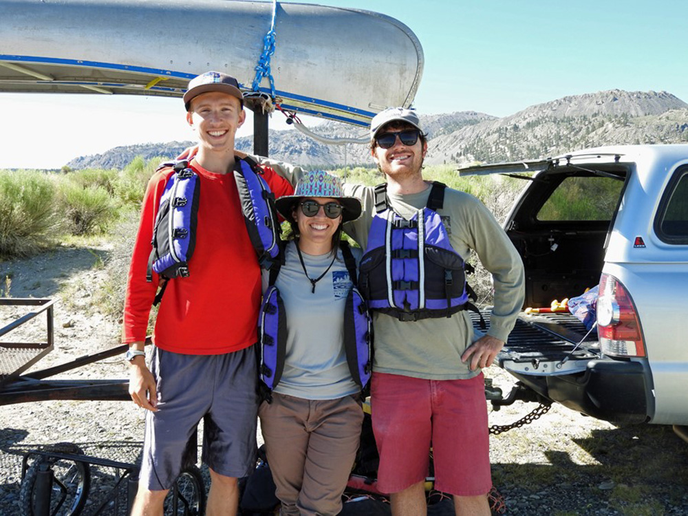 Adam, Grace, and Matt prepare for a morning of leading canoe tours on Mono Lake. Photo by Sandra Noll.