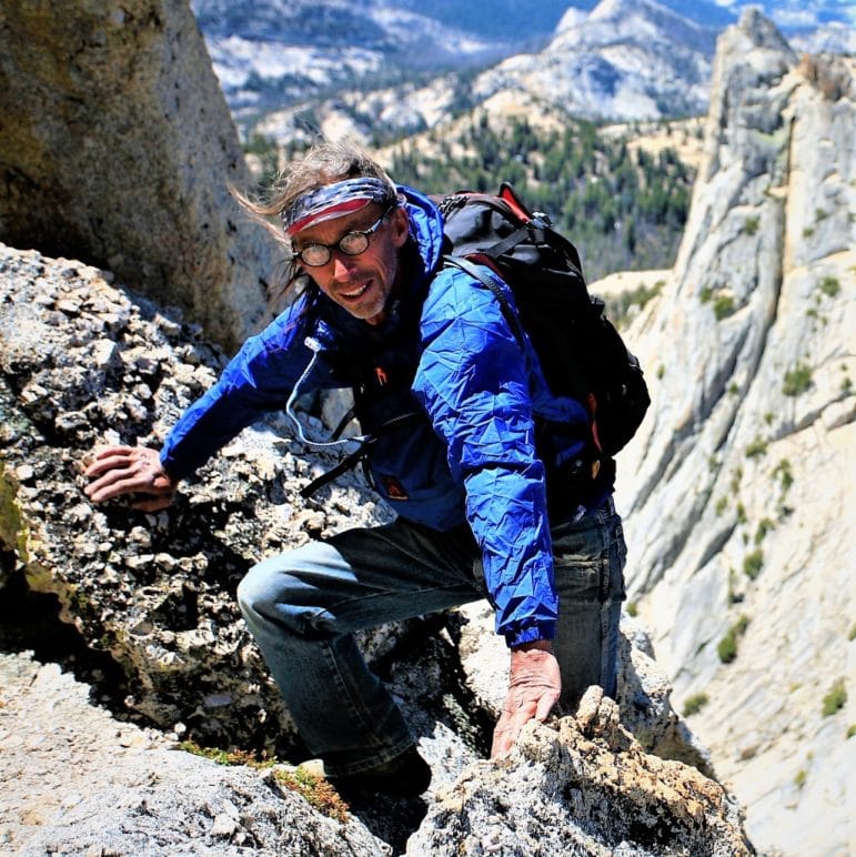 Bill Lundeen climbing in a mountain.