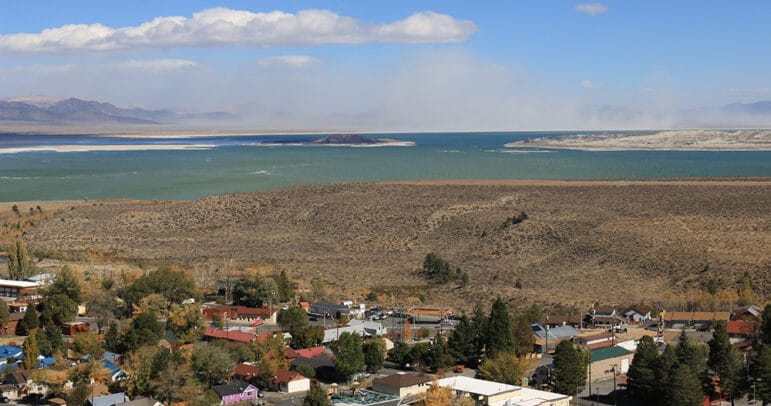 Windblown alkali dust blowing off the north shore of Mono Lake with Lee Vining in the foreground.