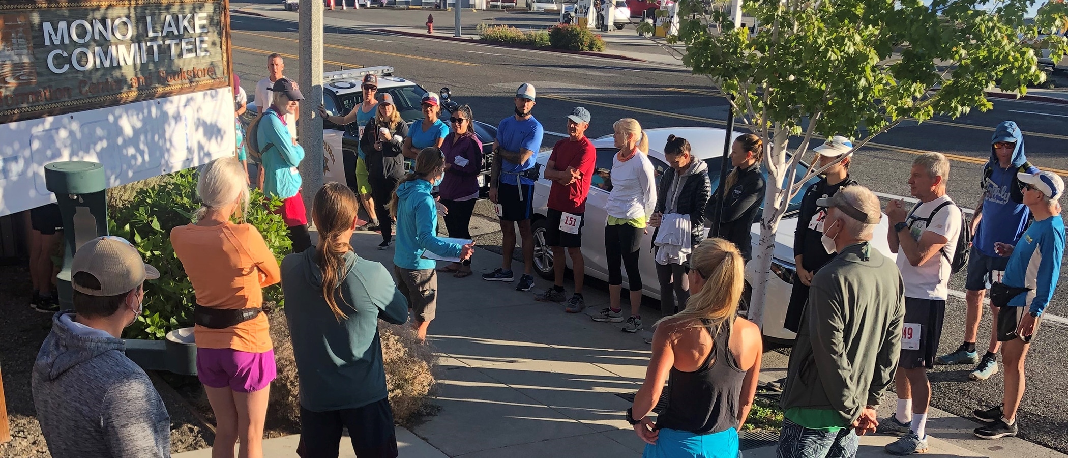 A crowd of people lined up along a street.