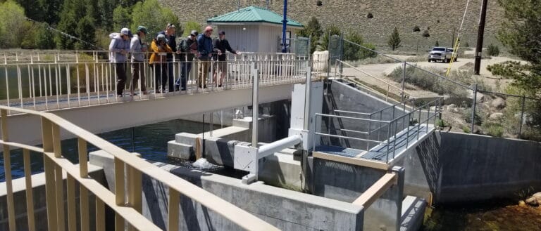 People looking downstream on Lee Vining Creek from the Los Angeles Department of Water and Power water diversion infrastructure.