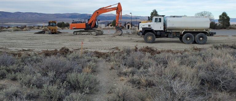 Heavy equipment parked in front of the Mono Basin Scenic Area Visitor Center.