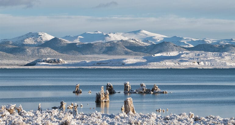 Snow covered view of Mono Lake and tufa with the islands Paoha and Negit in the distance.